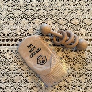 Cream Baby Socks with Cute Design and wooden rattle